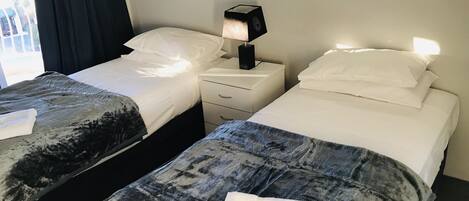 Individually decorated, iron/ironing board, cots/infant beds