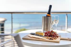 Enjoy a romantic meal on the balcony with a stunning ocean view.