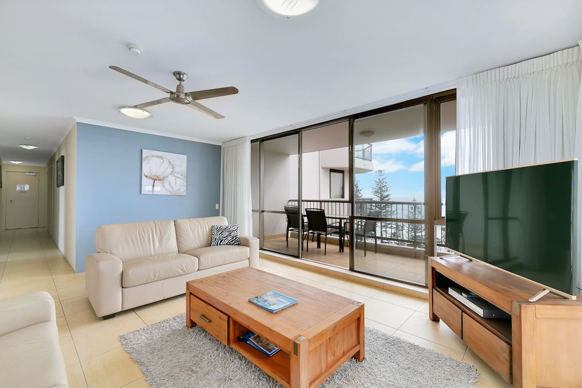 One-Bedroom Apartment - Ocean View | Living area | 55-inch flat-screen TV with cable channels, TV