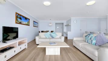 Two-Bedroom Apartment - Ocean View | Living room | 55-inch flat-screen TV with cable channels, TV
