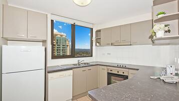 Apartment, 2 Bedrooms | Private kitchen | Fridge, microwave, stovetop, dishwasher