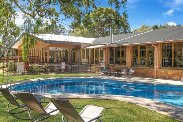 Outdoor pool, open 8 AM to 8 PM, pool loungers