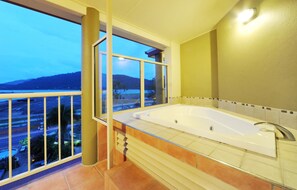 Shower, designer toiletries, hair dryer, towels