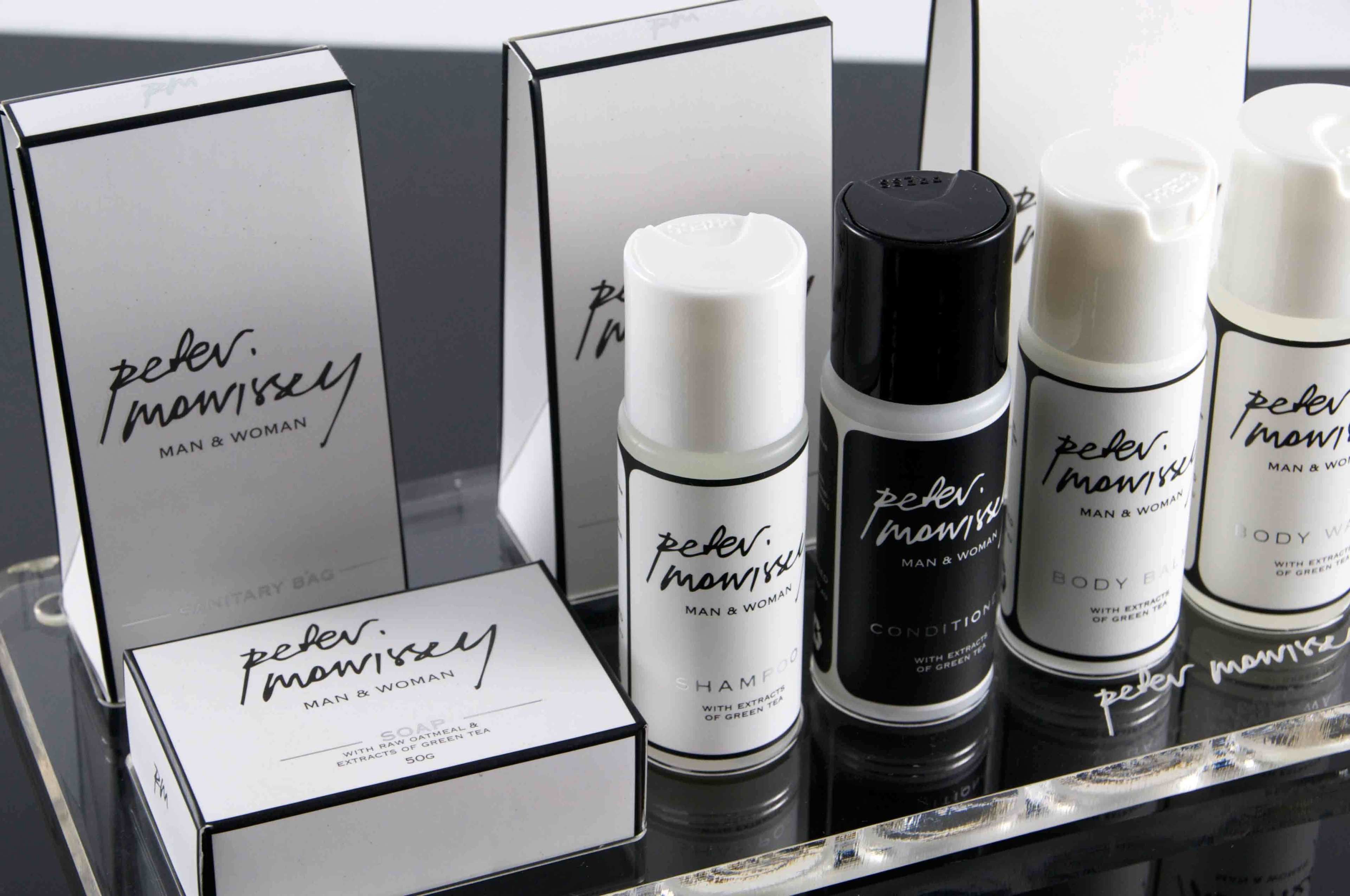 A display of Peter & Moisesy products including a box, shampoo, body wash, and conditioner.