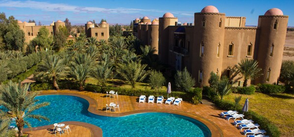 2 outdoor pools, open 7 AM to 9 PM, pool umbrellas, pool loungers