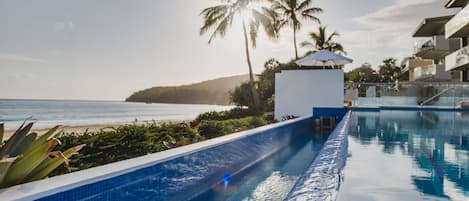 Outdoor pool, pool umbrellas, sun loungers