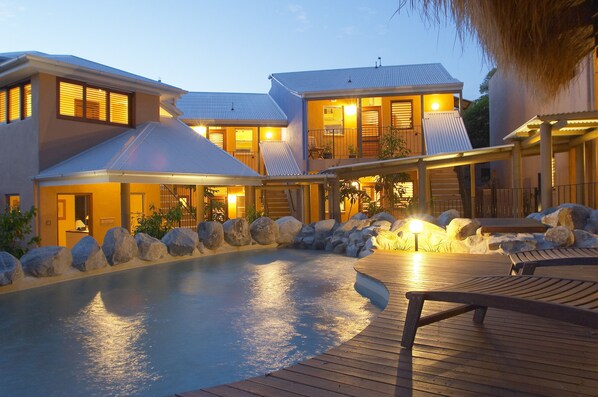 Outdoor pool, a heated pool, open 6 AM to 8 PM, free pool cabanas