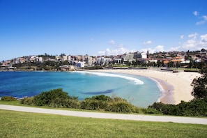 Beach nearby, white sand, beach towels