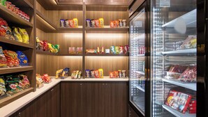 A snack display with various packaged foods in a store. - Microtel Inn & Suites by Wyndham Anderson/Clemson (Anderson)
