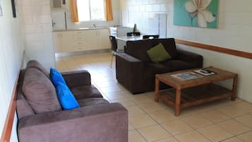 Standard Apartment, 1 Bedroom | Living area | 32-inch flat-screen TV with digital channels, TV