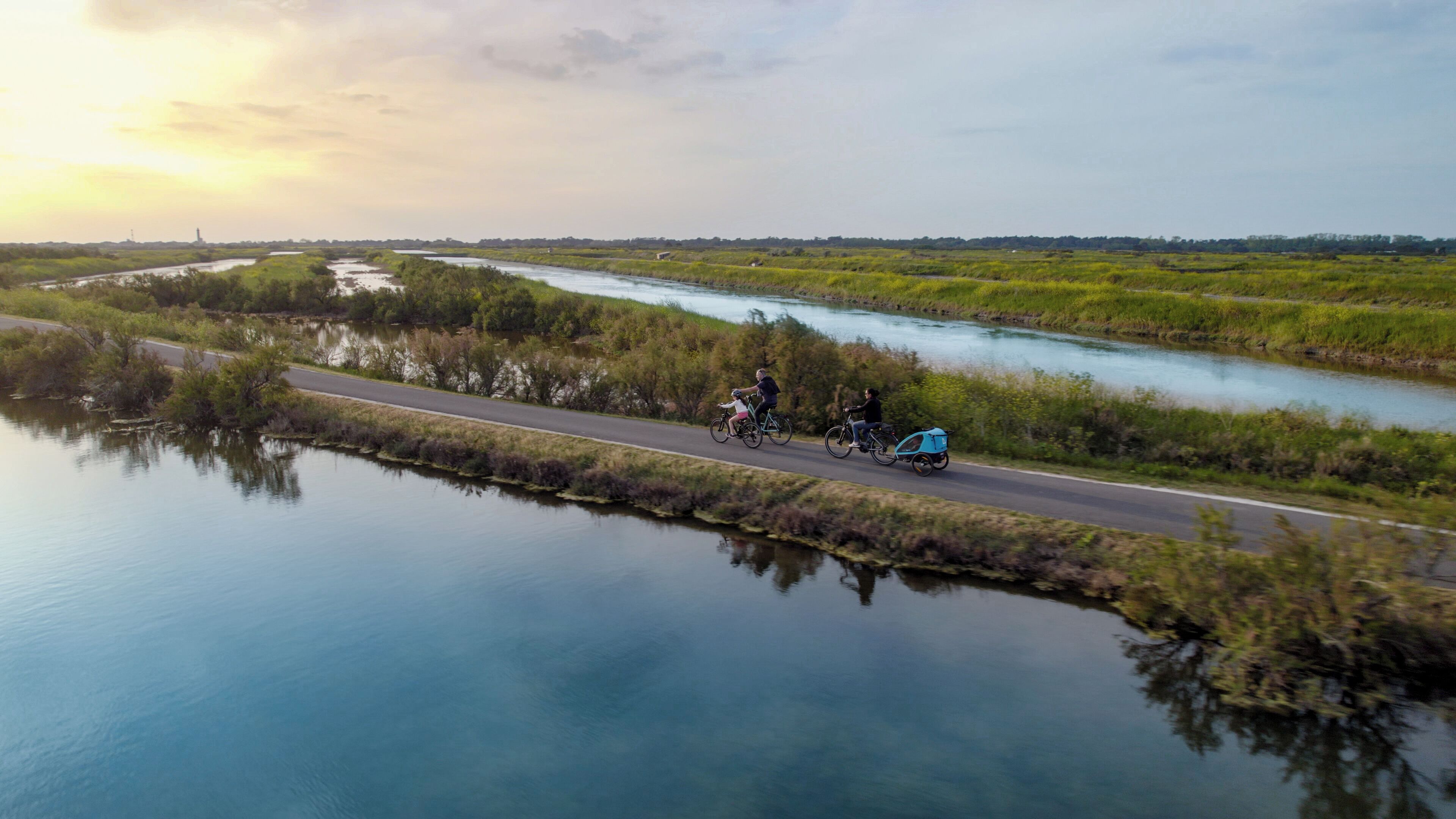 A river with a road running alongside it.