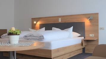 Premium bedding, desk, blackout drapes, iron/ironing board (on request)