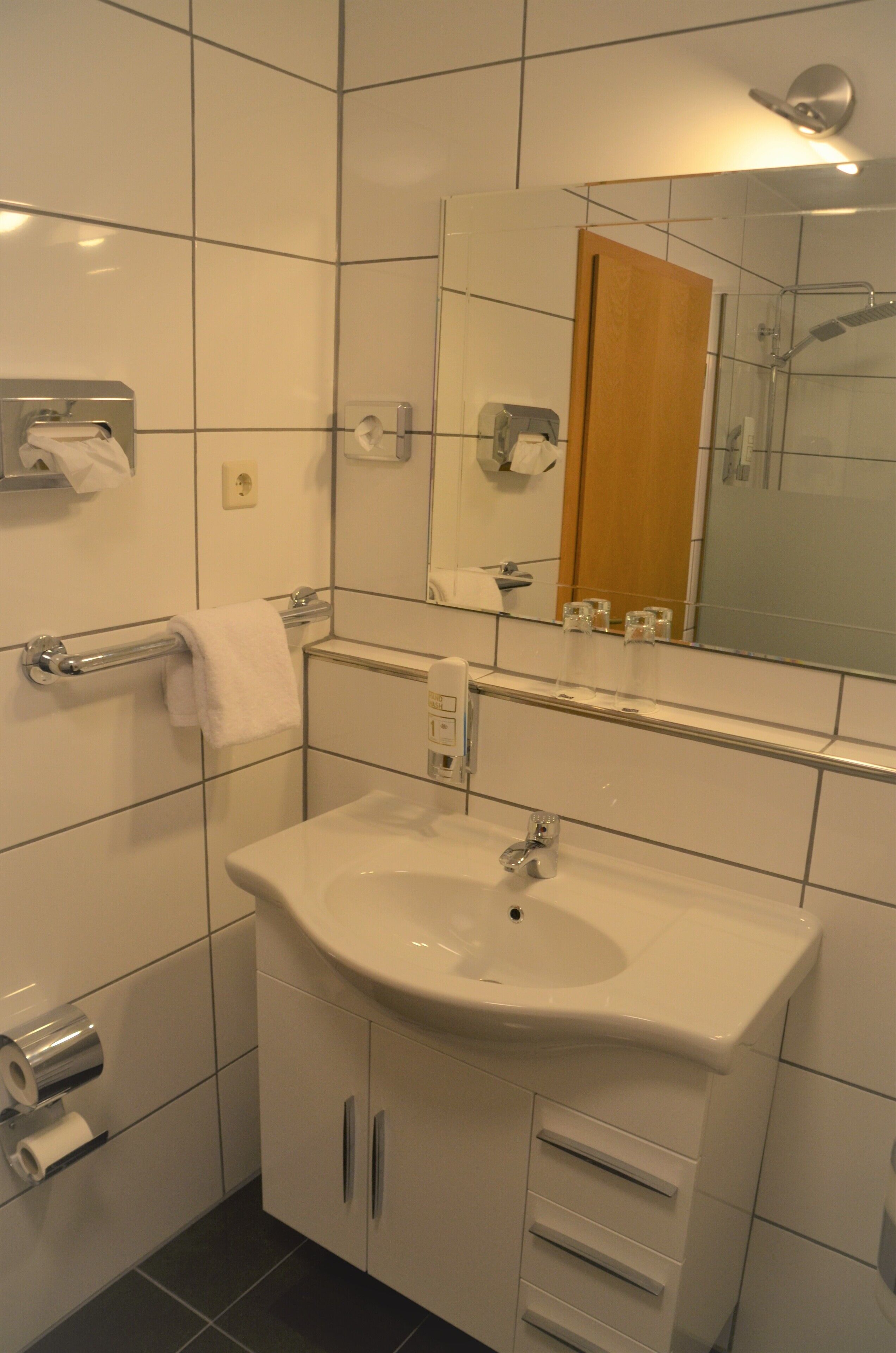superior double room | bathroom | shower, hair dryer, towels