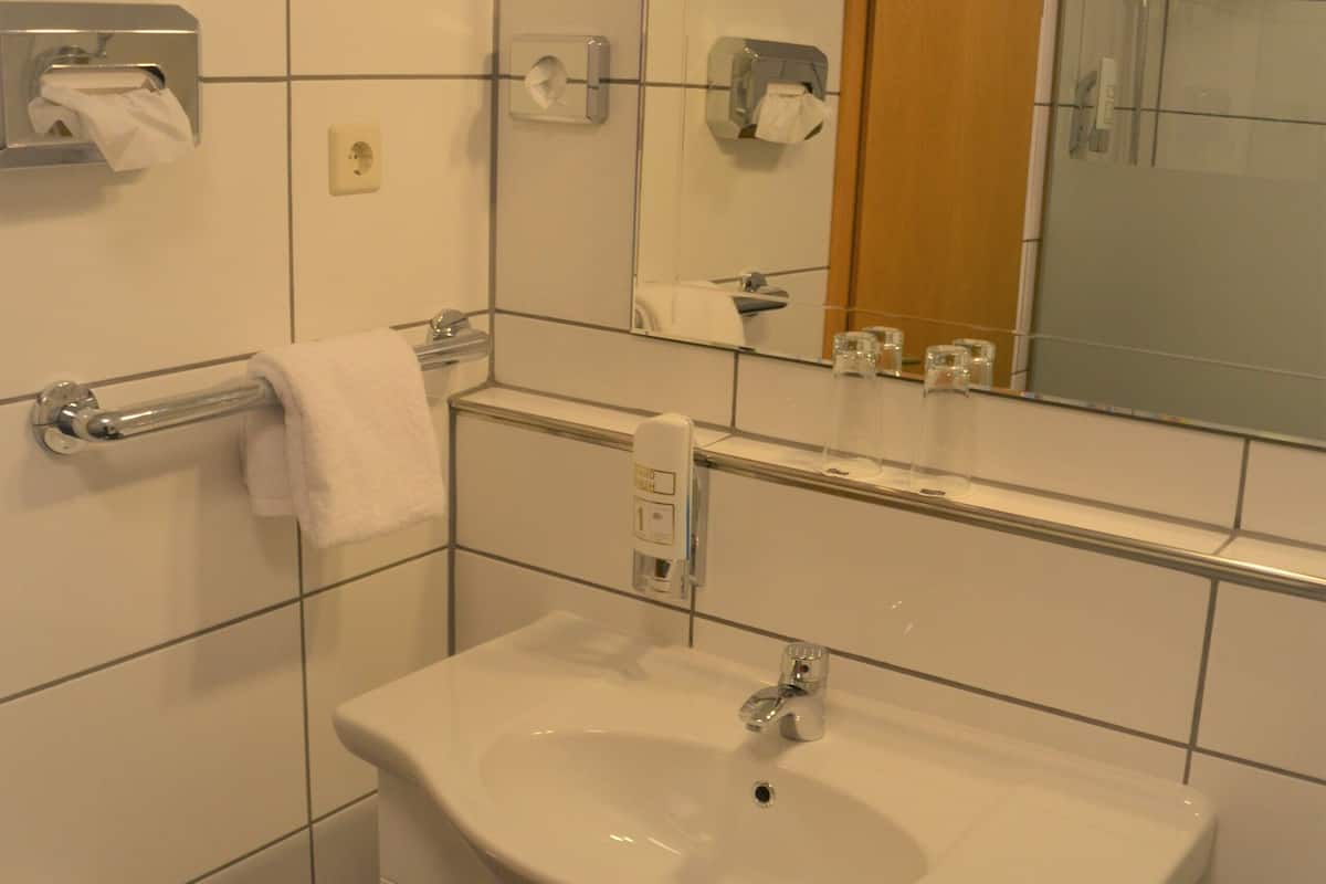superior double room | bathroom | shower, hair dryer, towels