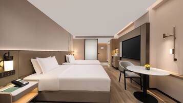 Down duvets, memory-foam beds, desk, laptop workspace