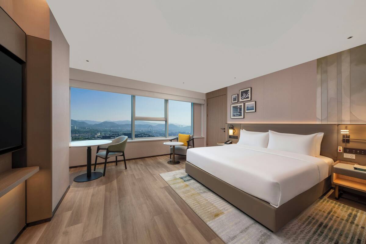 Habitación Premium, 1 cama King size, con acceso para personas discapacitadas, vista a la ciudad | Edredón, camas con efecto memoria y minibar