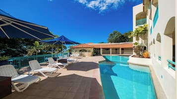 2 outdoor pools, pool umbrellas, pool loungers