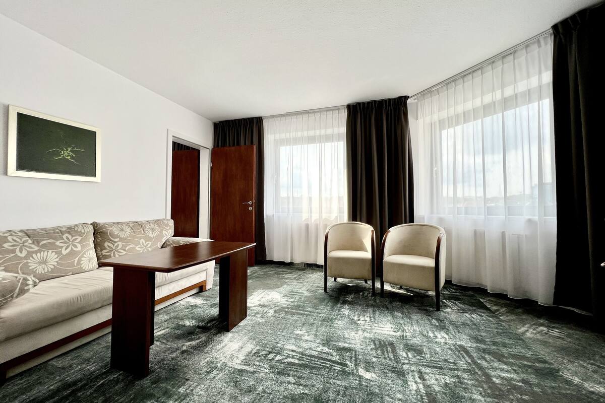 classic suite | living room | 32-inch lcd tv with satellite channels, tv, books