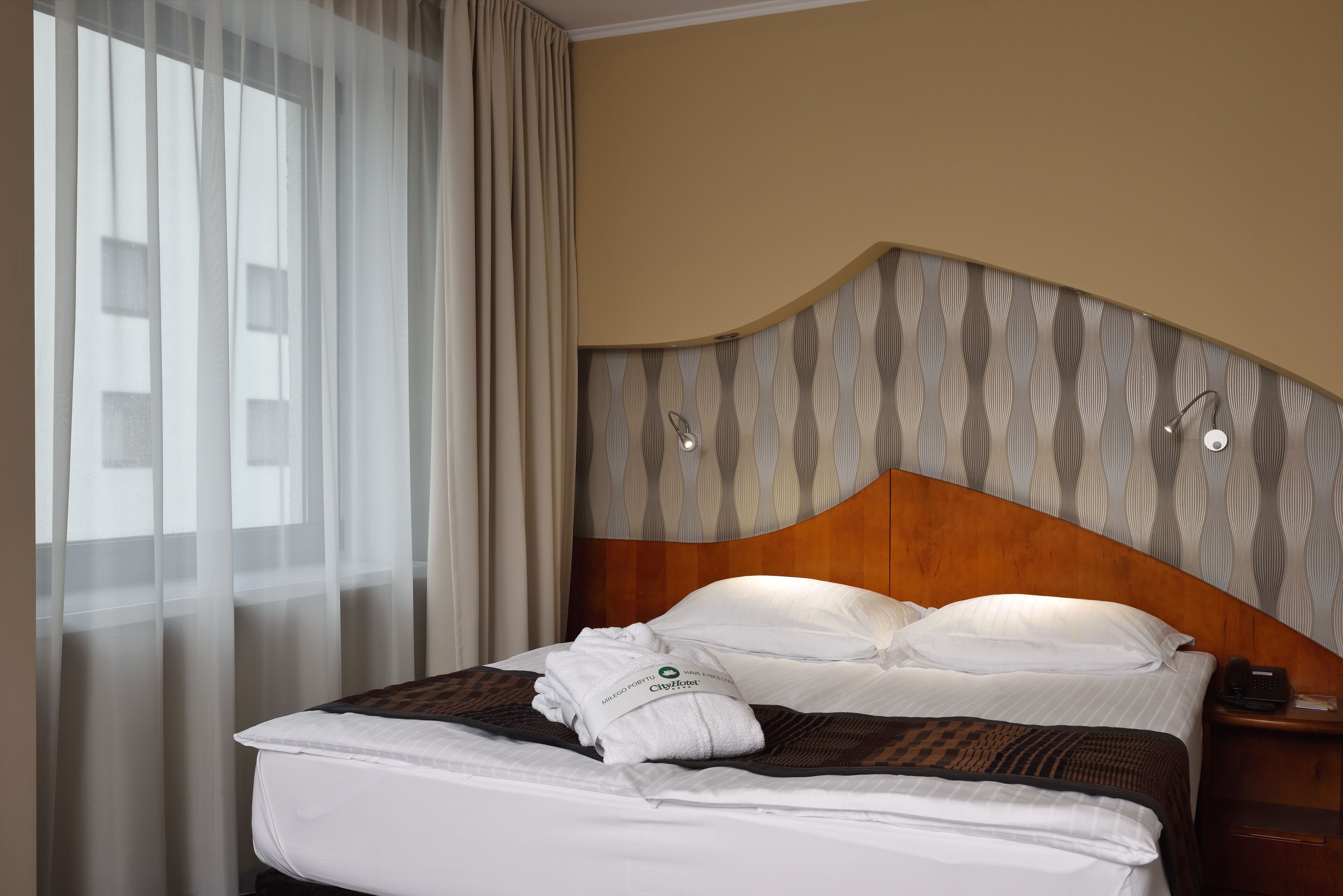 hypo-allergenic bedding, in-room safe, desk, blackout curtains