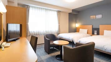 Premium bedding, desk, laptop workspace, blackout drapes