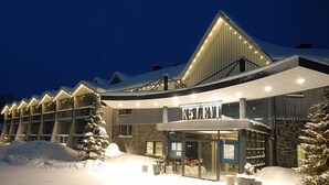 A hotel with a modern design, featuring a large entrance and multiple windows. - Hotel K5 Levi (Kittila)