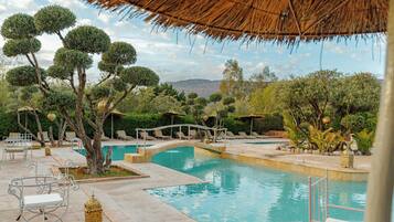 Outdoor pool, open 9:00 AM to 7:30 PM, pool umbrellas, pool loungers