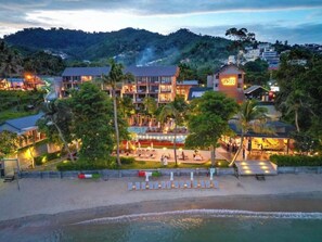 A beachfront hotel with multiple buildings, a pool area, and a beach with lounge chairs. - Mercure Koh Samui Beach Resort (Koh Samui)