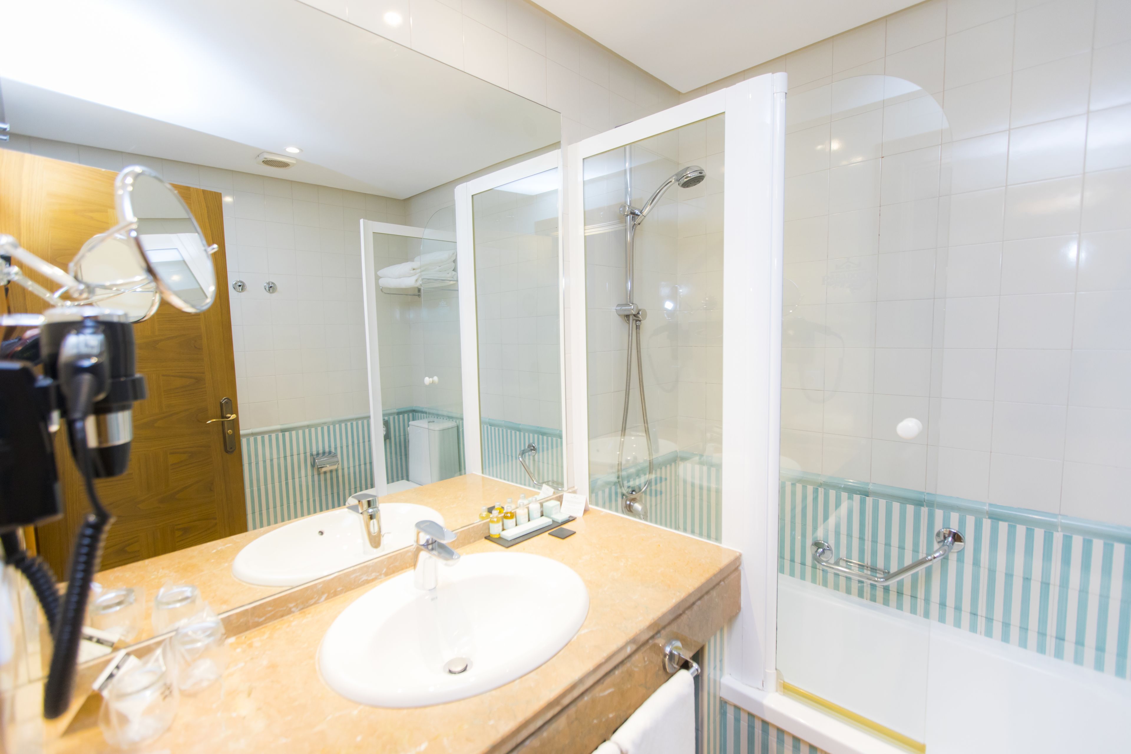 bathtub, eco-friendly toiletries, hair dryer, bidet