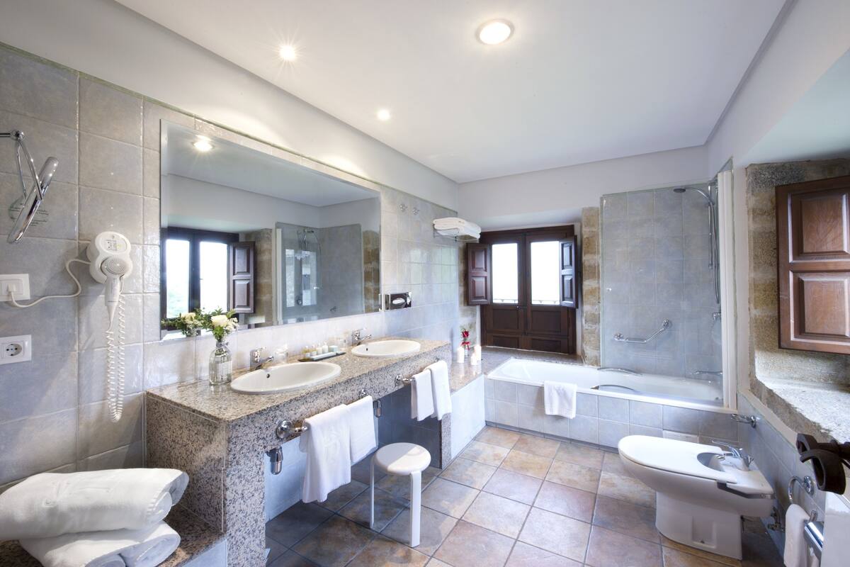 bathtub, free toiletries, hair dryer, bidet