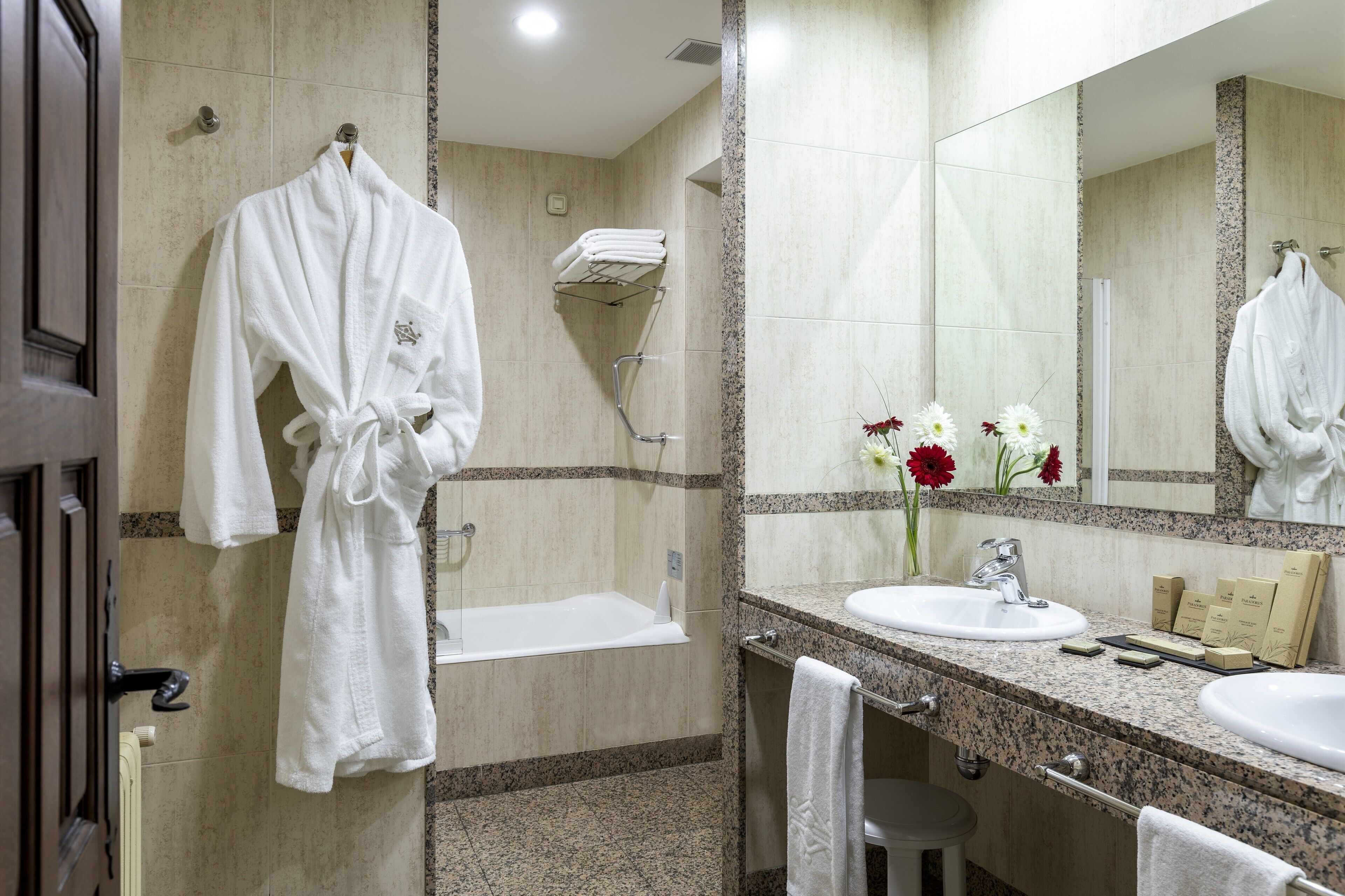 junior suite | bathroom | bathtub, eco-friendly toiletries, hair dryer, towels