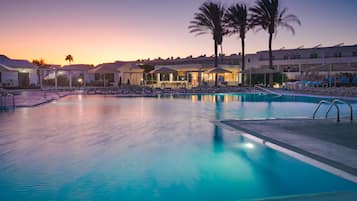 Indoor pool, outdoor pool, pool umbrellas, lifeguards on site