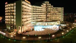 A multi-story hotel with a central atrium and a pool area. - Marvel (Nessebar)