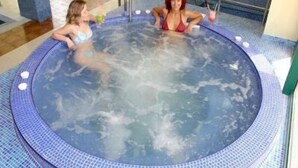 A hot tub with two people sitting inside. - Marvel (Nessebar)