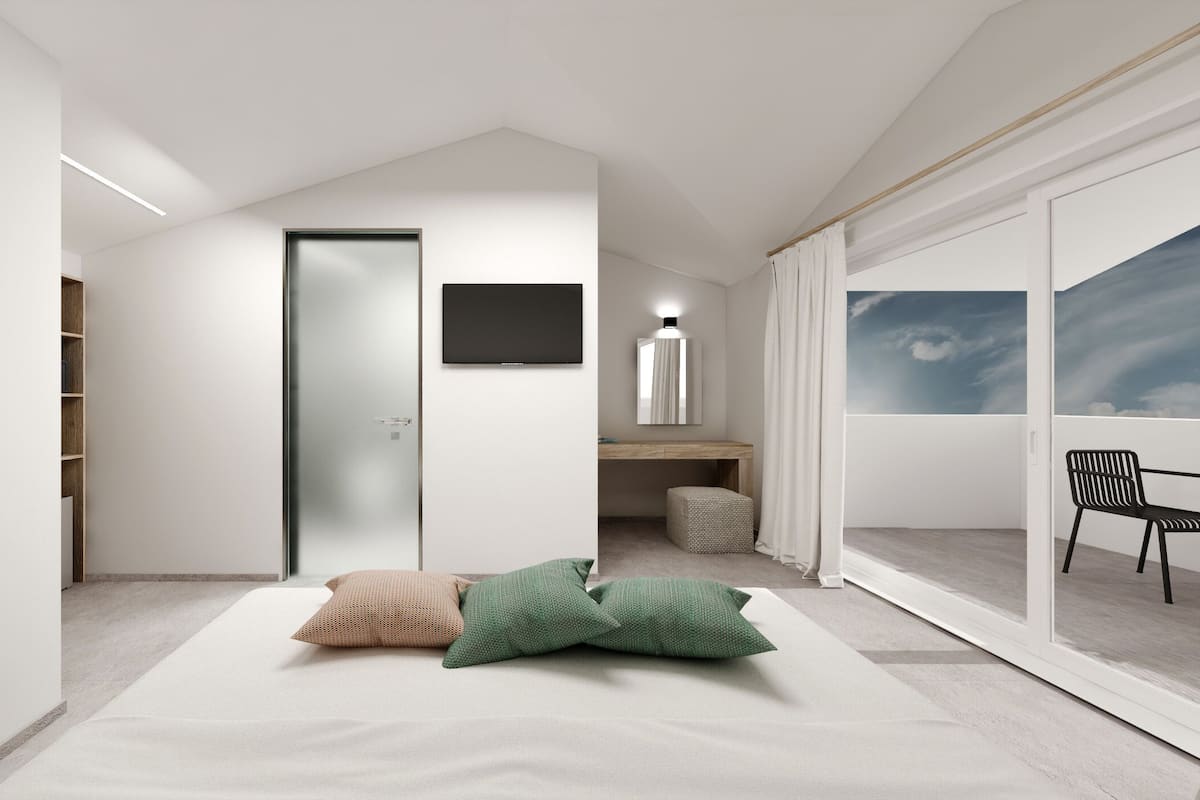 Ein modernes, minimalistisches Schlafzimmer mit großem Fenster, einem Flachbildfernseher und einer gemütlichen Leseecke.