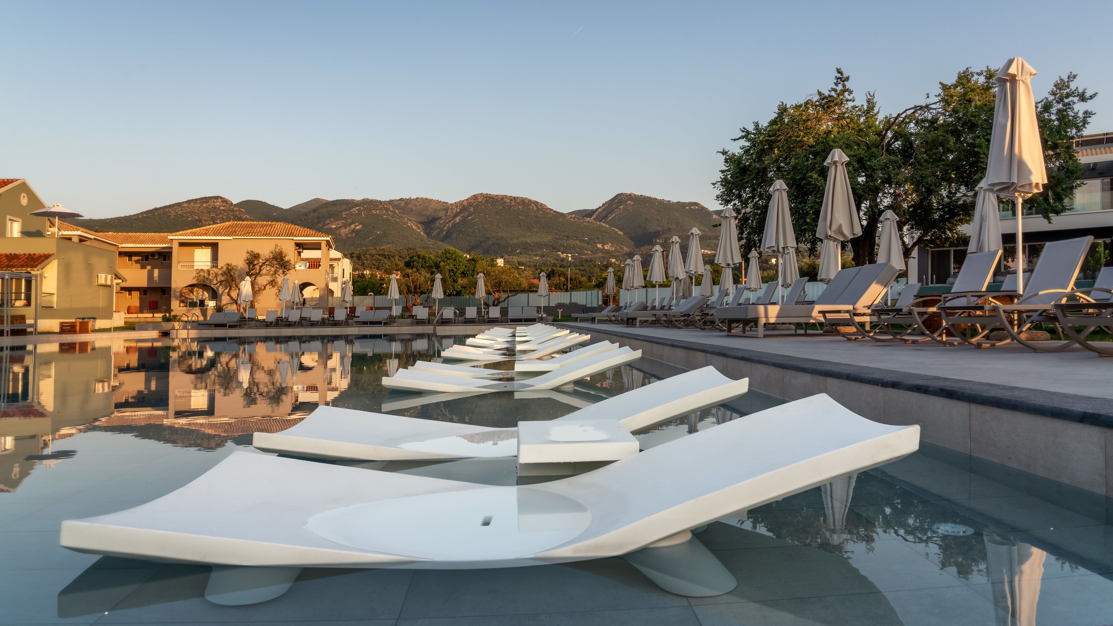 outdoor pool, pool umbrellas, pool loungers