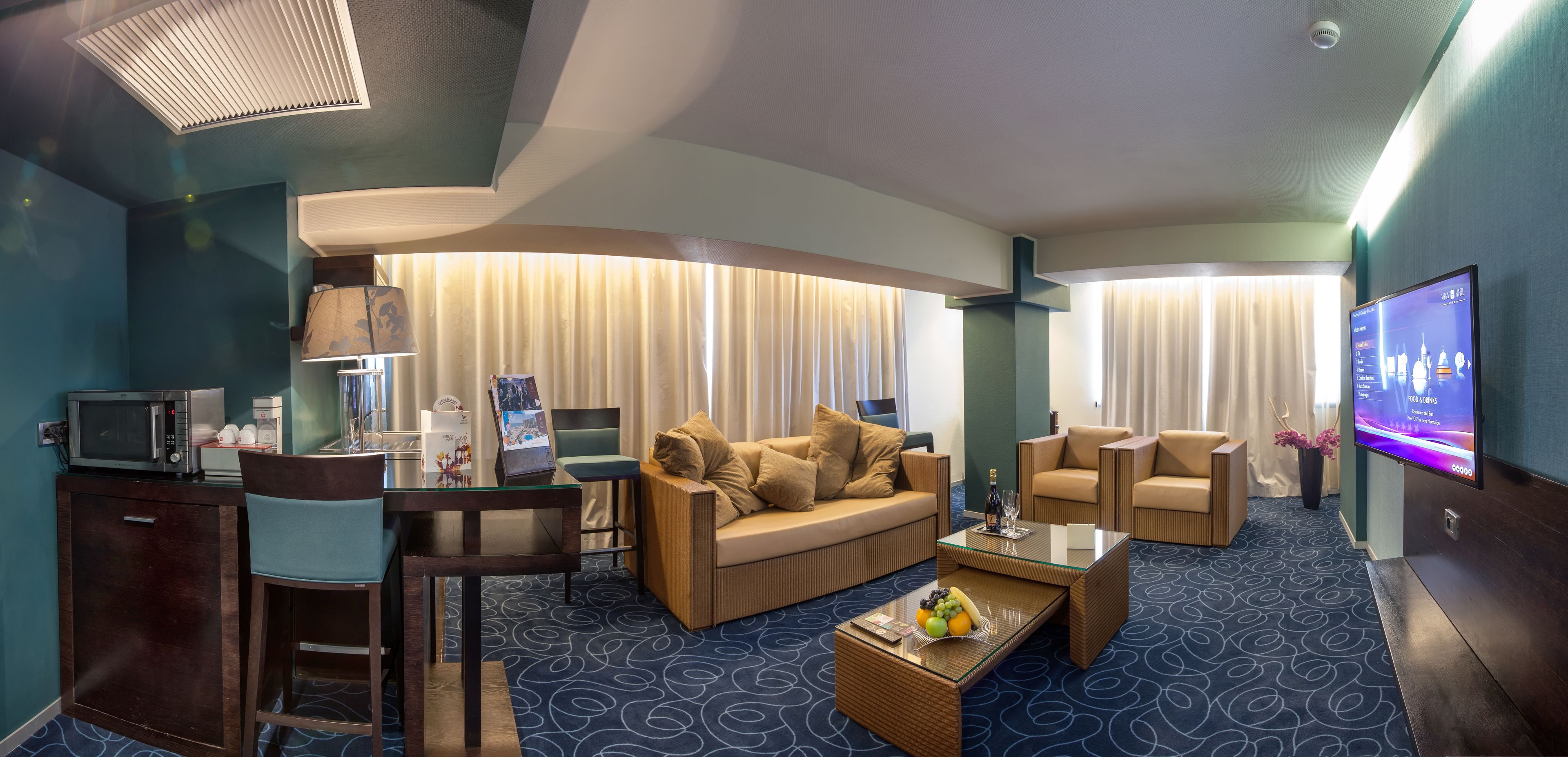 junior suite, 1 king bed (lateral sea view) | living area | lcd tv