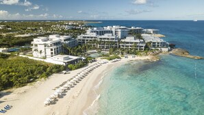 A resort with beachfront villas, a sandy beach, and clear blue waters. - Four Seasons Resort and Residences Anguilla (West End Village)