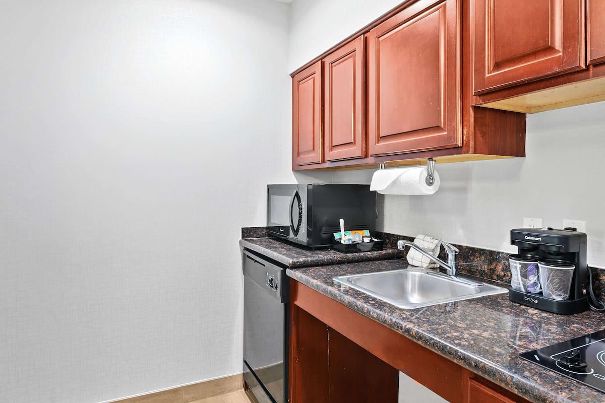 full-sized fridge, microwave, coffee/tea maker, cookware/dishes/utensils