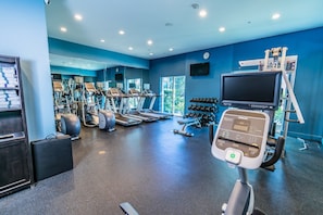 A gym with treadmills, weights, and exercise equipment. - Holiday Inn Houston Webster by IHG (Webster)