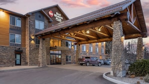 A Best Western Plus hotel with a stone facade, wooden beams, and a covered entrance. - Best Western Plus Ponderay Mountain Lodge (Ponderay)