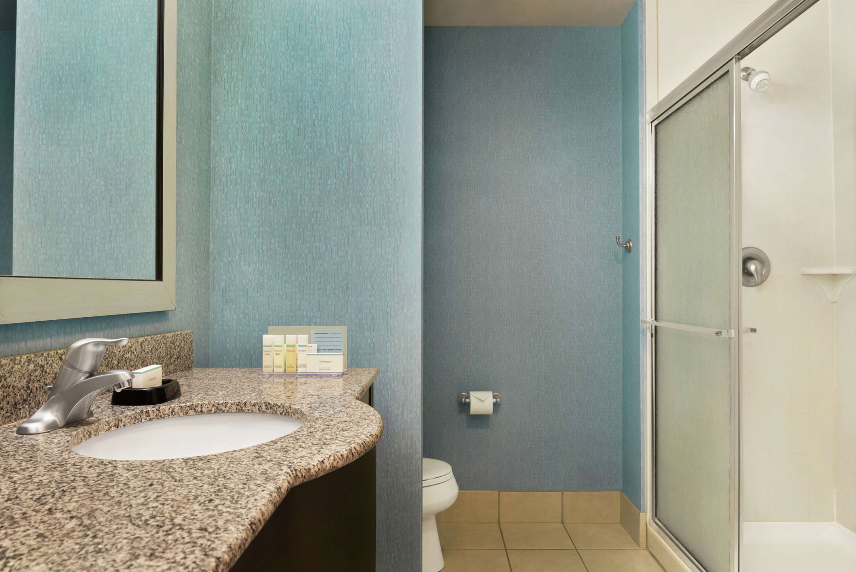 Bathroom | Designer toiletries, hair dryer, towels, soap