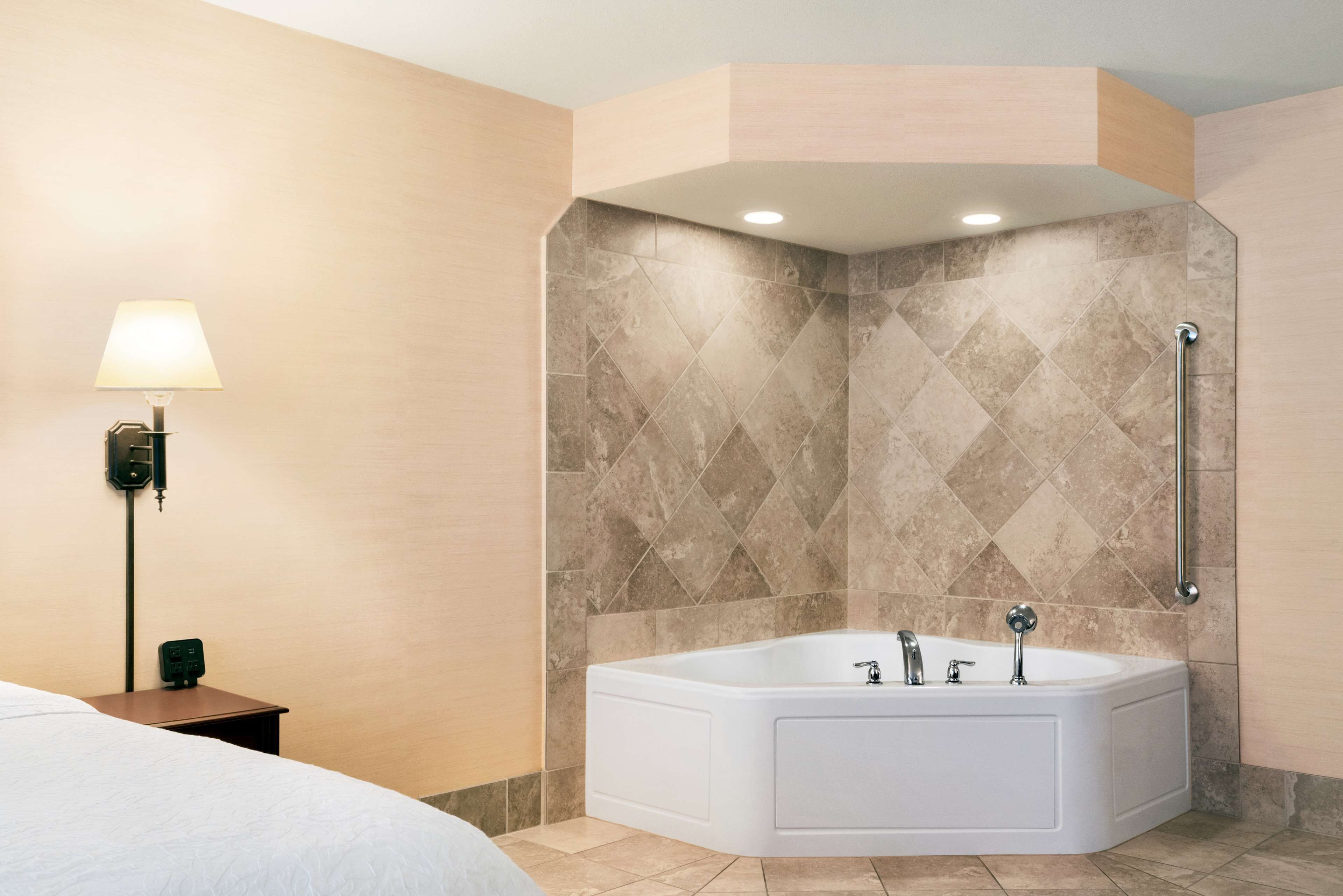 studio suite, 1 king bed, non smoking (whirlpool) | bathroom | designer toiletries, hair dryer, towels, soap