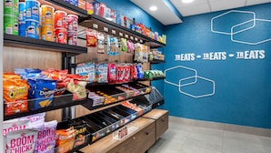 A snack aisle with various chips, snacks, and packaged foods.
