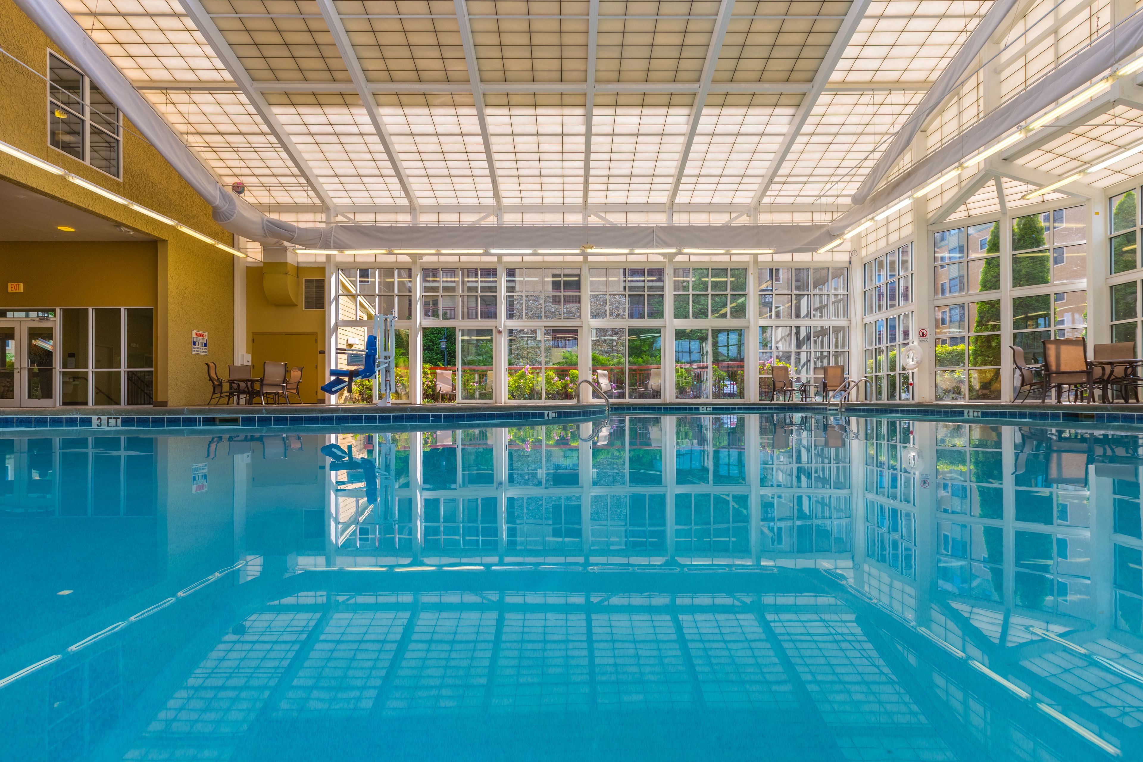 indoor pool, seasonal outdoor pool, pool umbrellas
