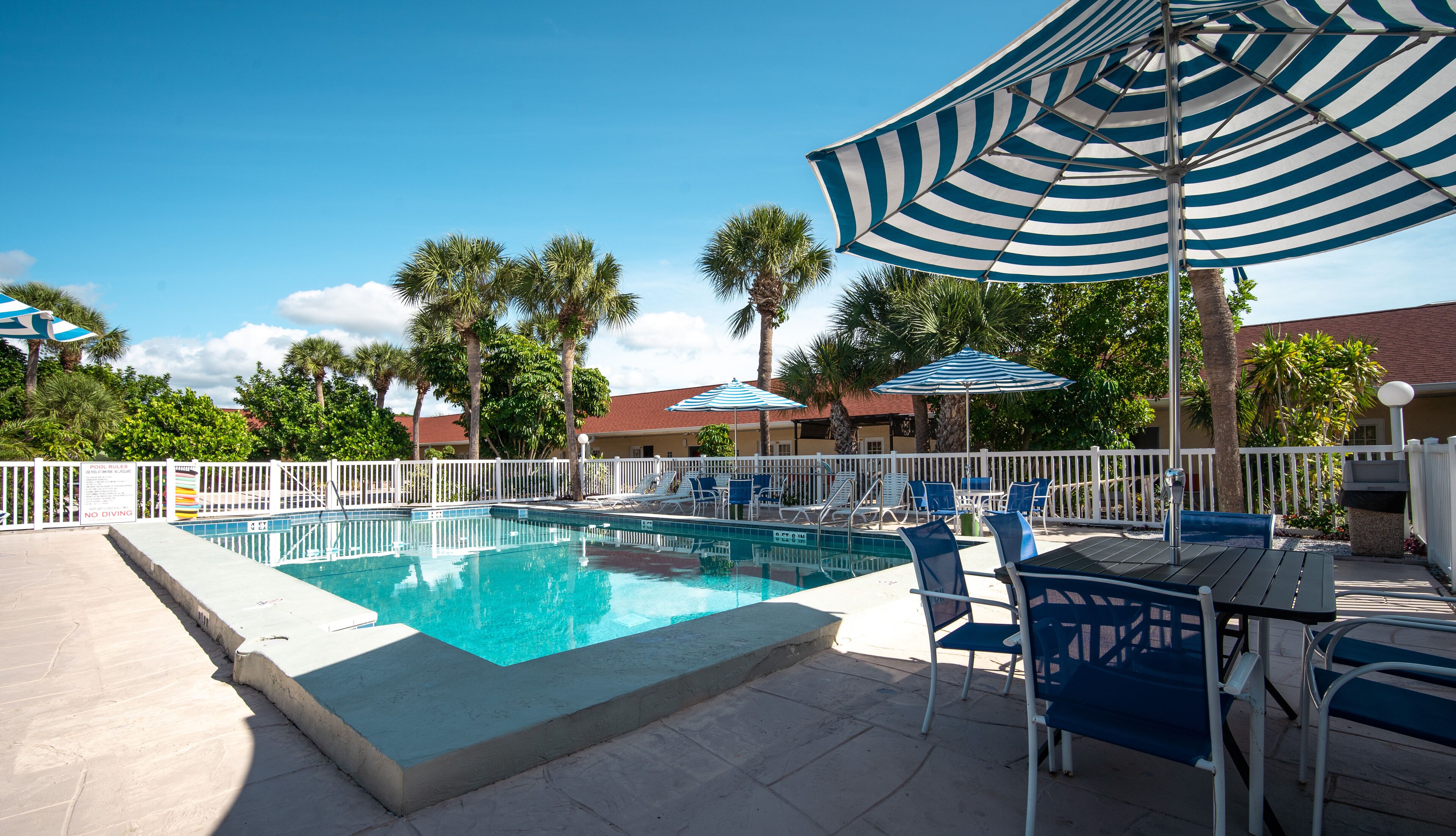 Outdoor pool, open 9:00 AM to 6:00 PM, pool umbrellas, sun loungers