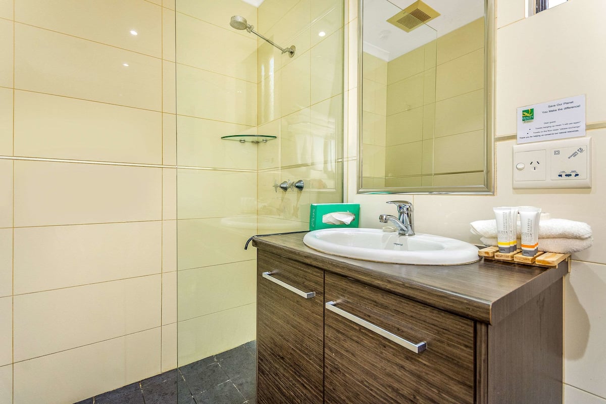 family room | bathroom | shower, designer toiletries, hair dryer, towels