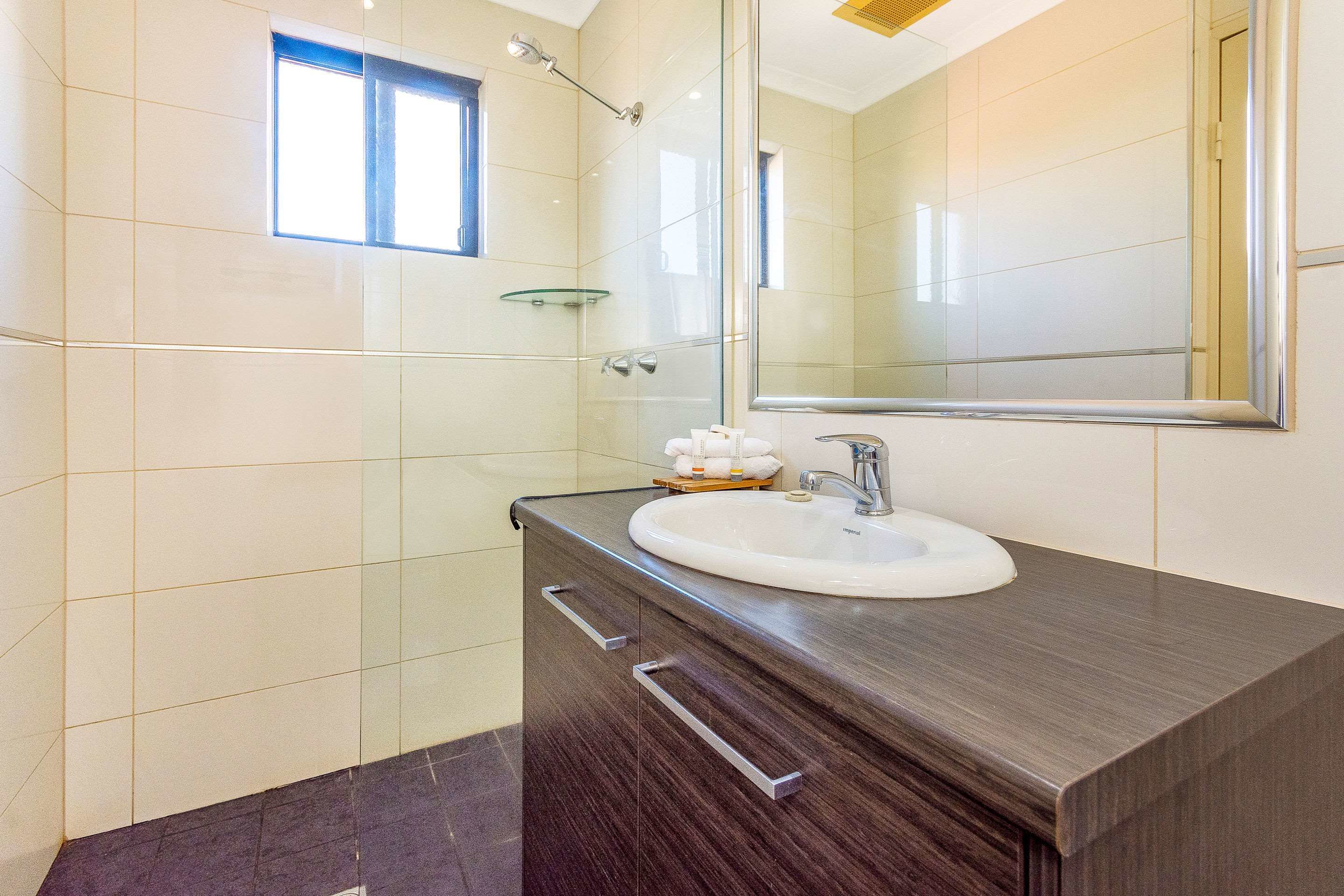 business room | bathroom | shower, designer toiletries, hair dryer, towels