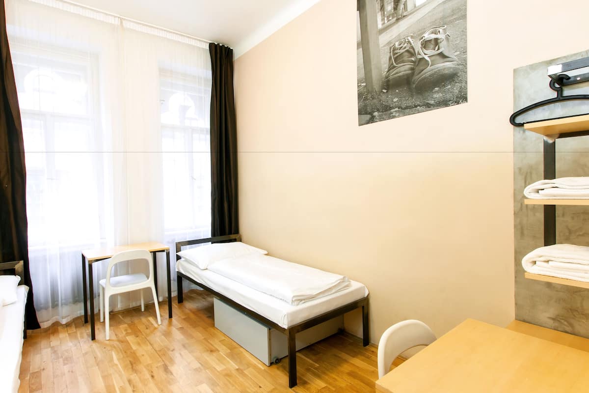 Basic Twin Room, 2 Single Beds, Shared Bathroom | Iron/ironing board, free WiFi, bed sheets
