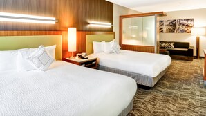 A hotel room with two beds, a nightstand, a lamp, a couch, and a large mirror. - SpringHill Suites By Marriott Columbia Fort Meade Area (Columbia)