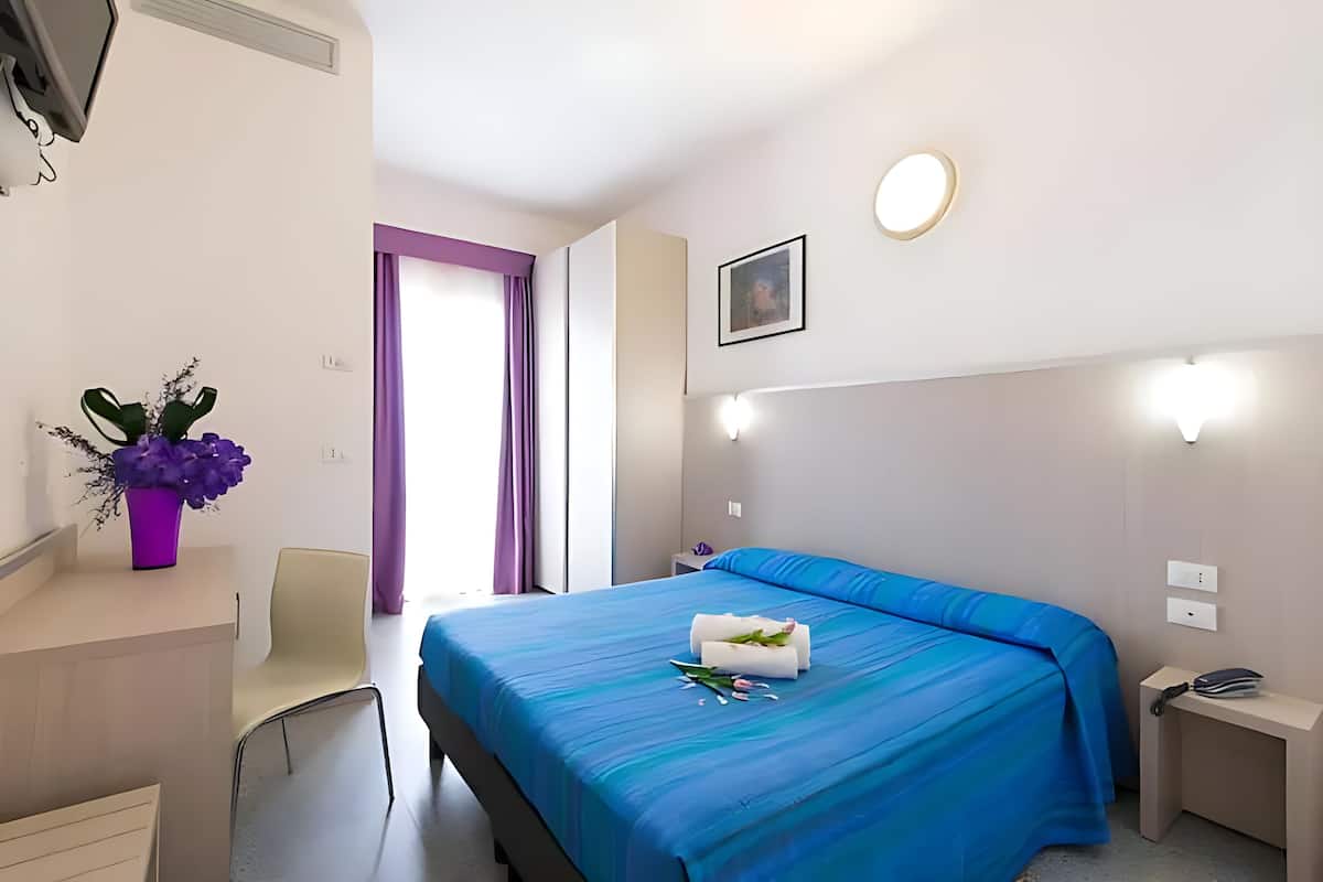 Premium bedding, down duvets, in-room safe, desk